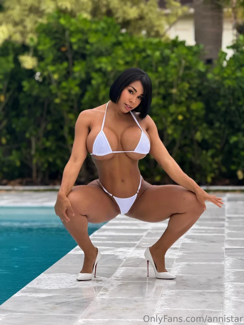 Naughty Anni Star in white bikini squatting by pool, showing off thick thighs and ass