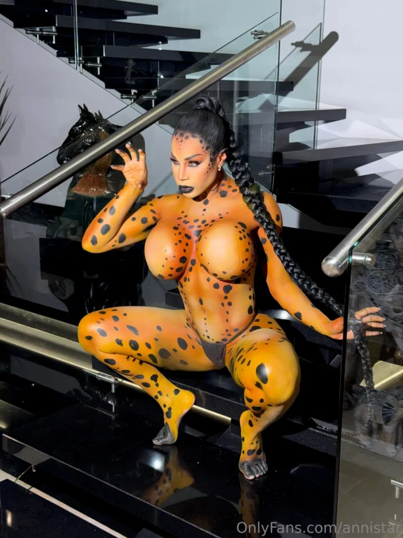 Sultry Anni Star in full body paint crouches on stairs, showing off her huge tits and ass