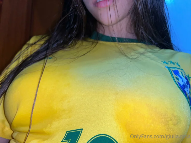 Seductive Giulia Rosa in tight yellow Brazil jersey, big tits pushing out the fabric