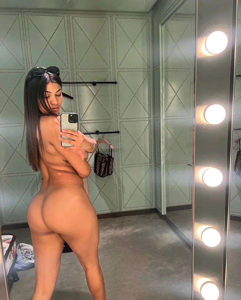 Busty lildedjanet taking a nude mirror selfie showing her thick ass in a dressing room